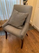 Blue upholstered chair on sabre legs