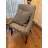 Blue upholstered chair on sabre legs