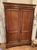 Modern mahogany linen press with four interior shelves