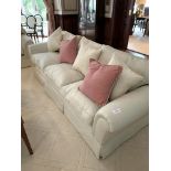 Cream cord effect upholstered three seat sofa, with feather filled cushions