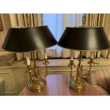 Two brass candelabrum style table lamps with metal shades