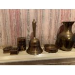 Two brass vases; two brass bowls with onyx eggs; stone covered trinket box; brass bell and others.