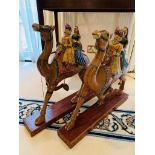 Pair of Indian carved wooden camels with riders