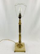 Brass column table lamp on stone base.