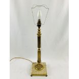 Brass column table lamp on stone base.