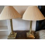 Two brass column table lamps with shades