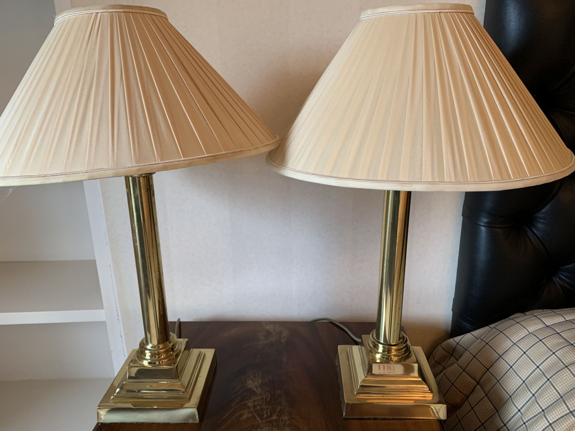 Two brass column table lamps with shades