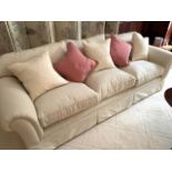 Cream cord effect upholstered three seat sofa, with feather filled cushions