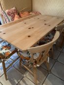 Pine kitchen pedestal table together with four Windsor-style chairs