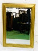 Gilt framed bevelled edge wall mirror