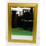 Gilt framed bevelled edge wall mirror