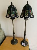 Two metal bedside lamps with stained glass shades