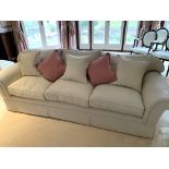 Cream cord effect upholstered three seat sofa, with feather filled cushions