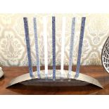 Chrome curved candle holder and candles