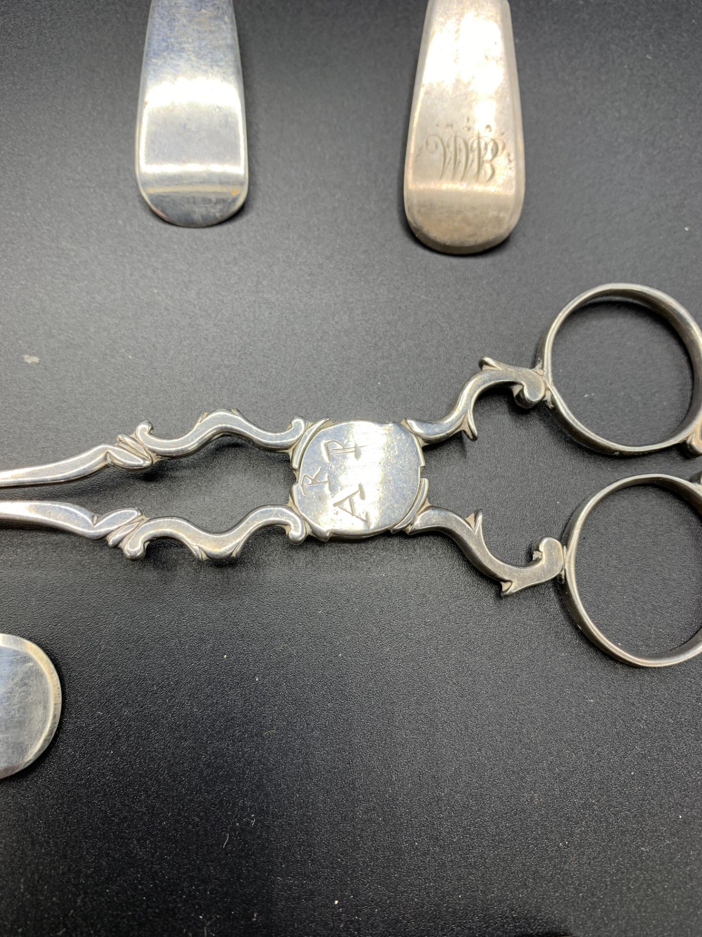 A pair of late 18th century silver sugar tongs, together with various Georgian silver spoons - Image 4 of 5