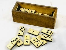 Complete set of bone and ebony dominoes in original box