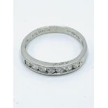 Platinum and diamond half eternity ring