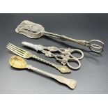 Very decorative silver gilt Victorian dessert fork and three other pieces of silver cutlery