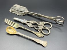 Very decorative silver gilt Victorian dessert fork and three other pieces of silver cutlery