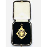 9ct gold medal by Kemp Bros, Union Street, Bristol, hallmarked 1934