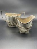 Sterling silver creamer and sugar bowl