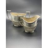 Sterling silver creamer and sugar bowl