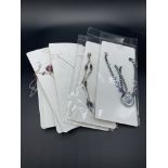 Collection of 15 individual sterling silver pendants and chains