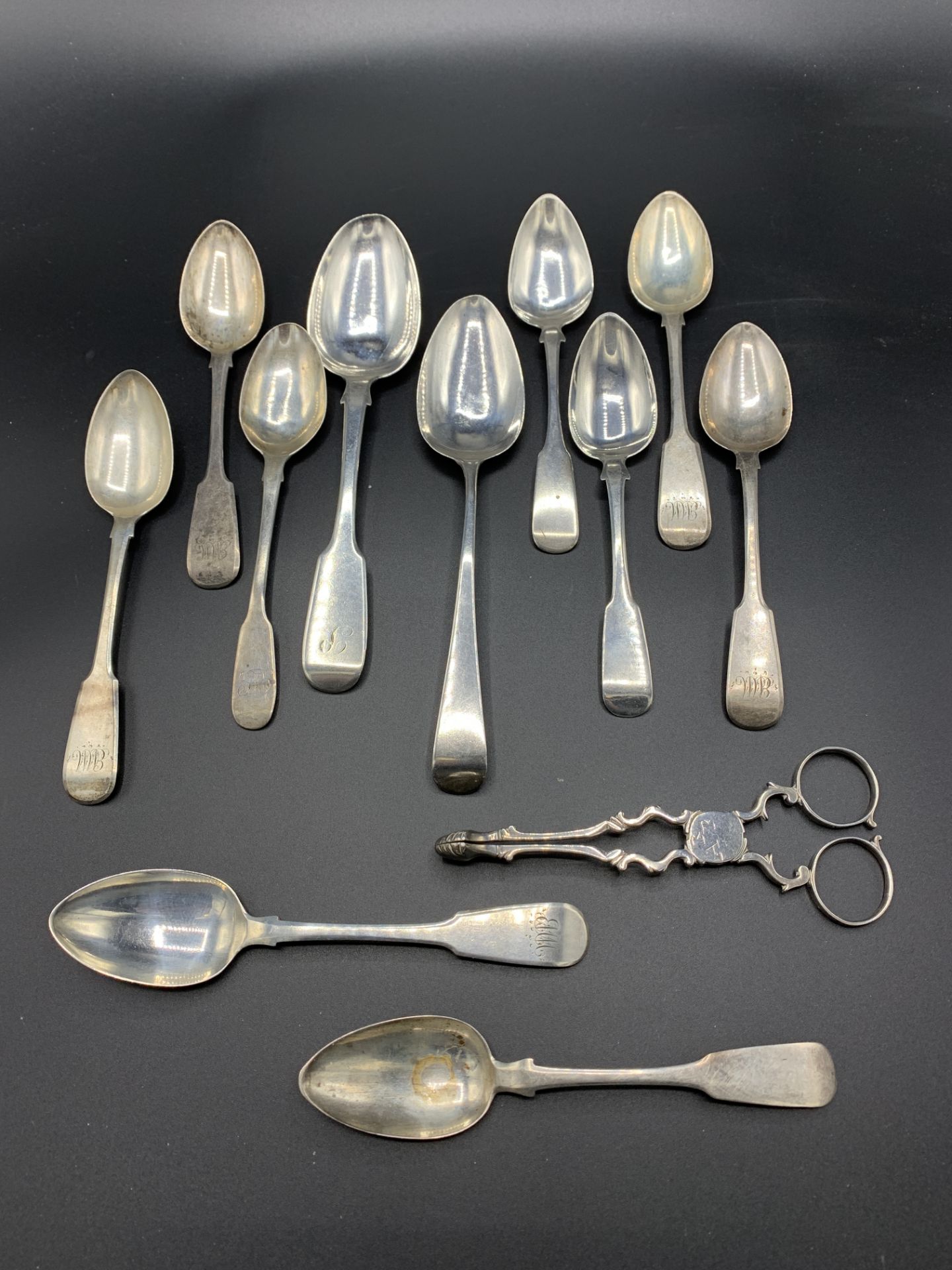 A pair of late 18th century silver sugar tongs, together with various Georgian silver spoons - Image 5 of 5