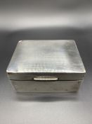 Hallmarked silver cigarette box, and a silver card case