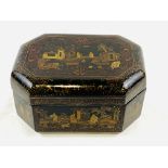 Black lacquered octagonal box with Chinese scenes to lid and panels
