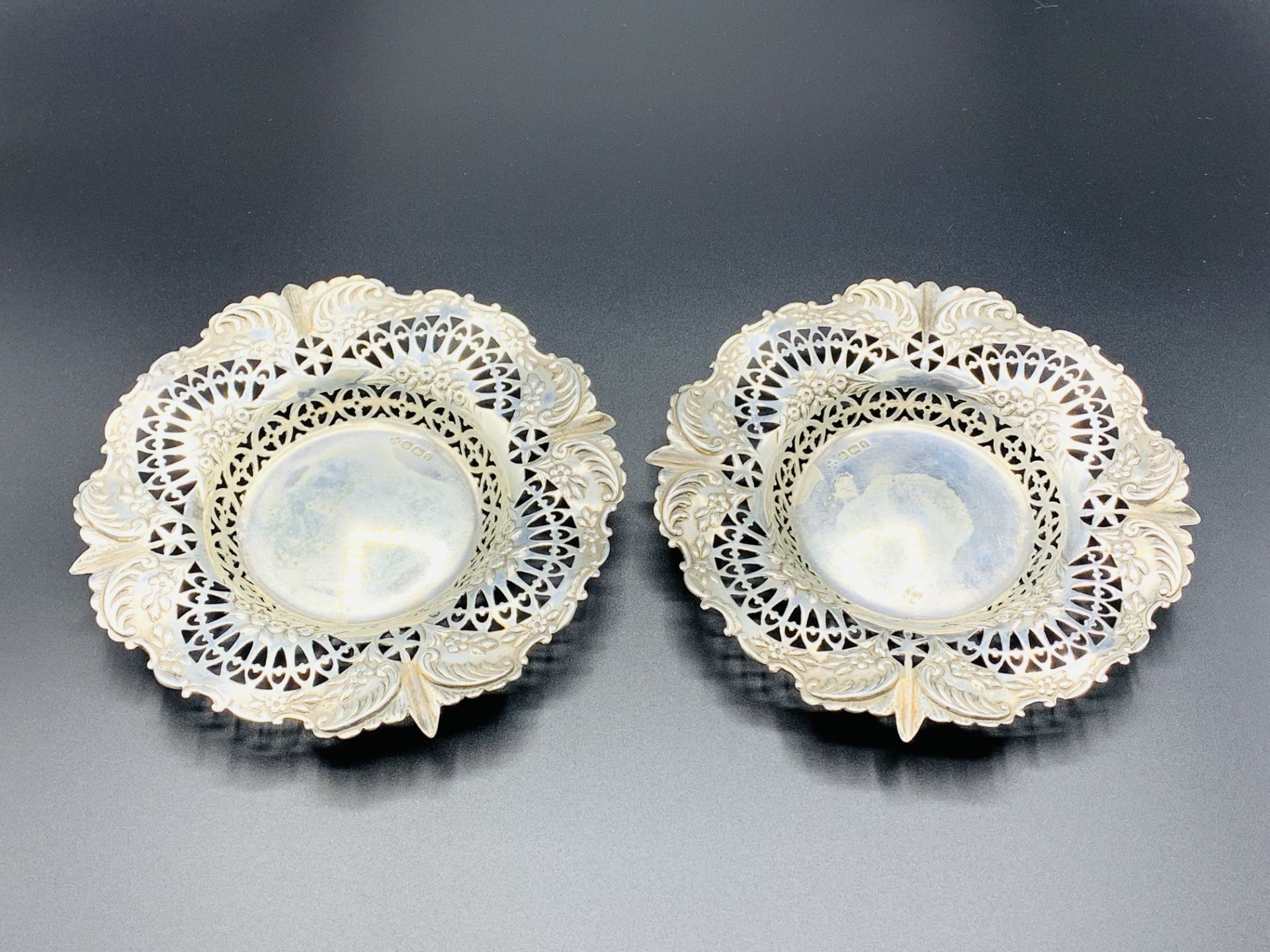 Two silver filigree dishes, Sheffield 1898, by Martin Hall & Co., and another silver dish