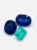 Two sapphires and an emerald