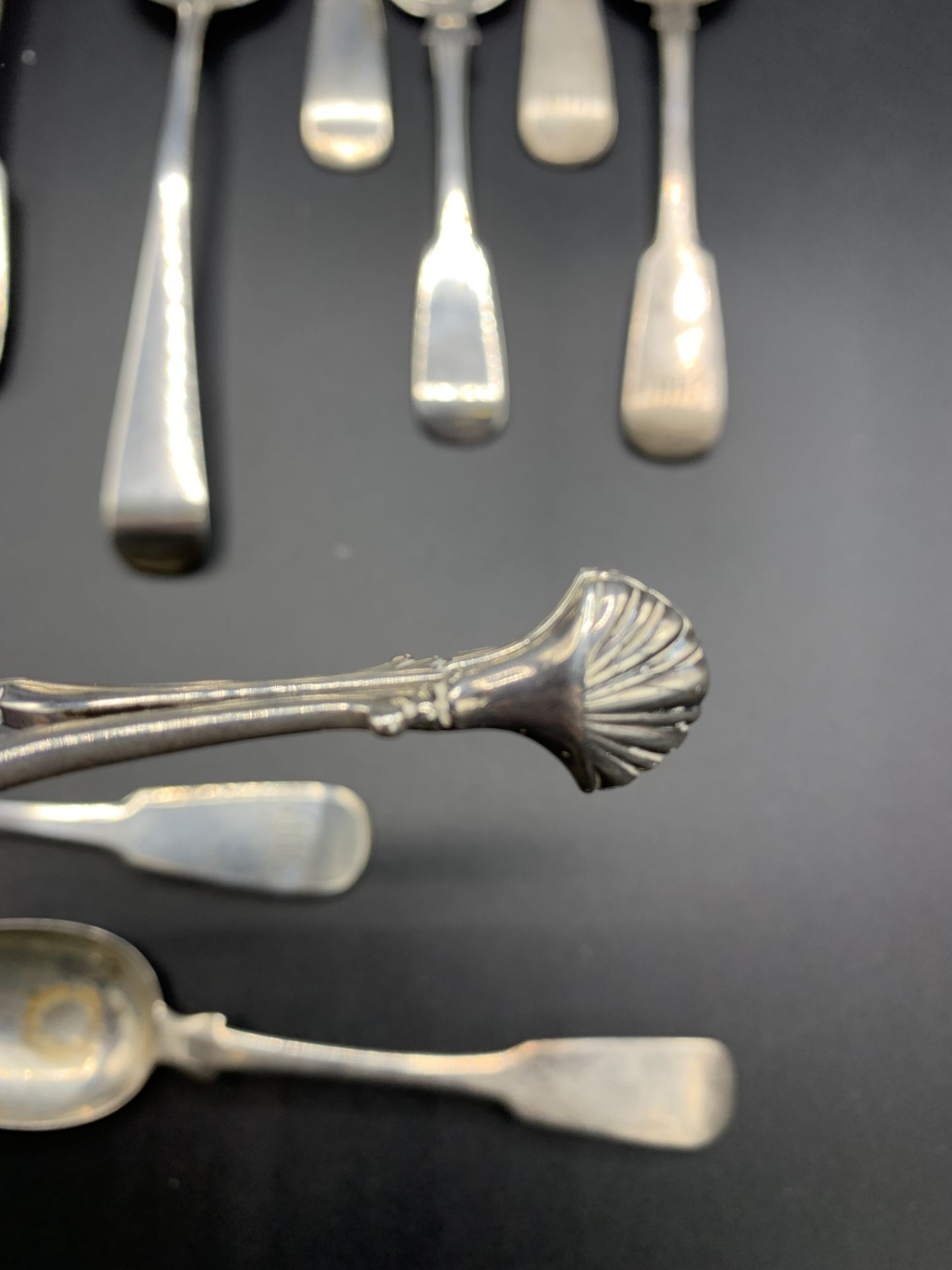 A pair of late 18th century silver sugar tongs, together with various Georgian silver spoons - Image 3 of 5