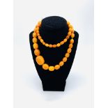 Graduated amber bead necklace