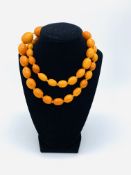 Graduated amber bead necklace