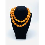 Graduated amber bead necklace