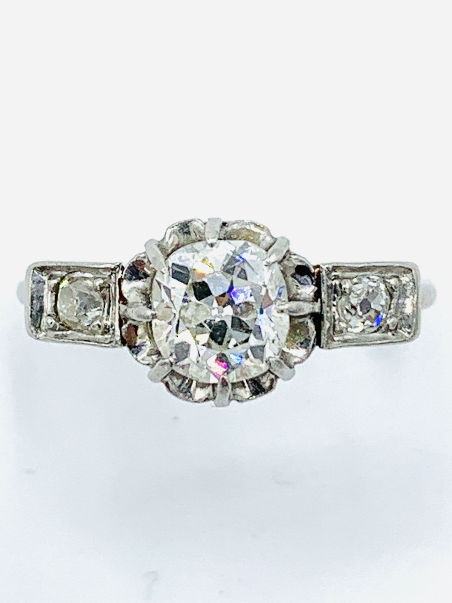 18ct white gold single stone diamond ring with diamond shoulders