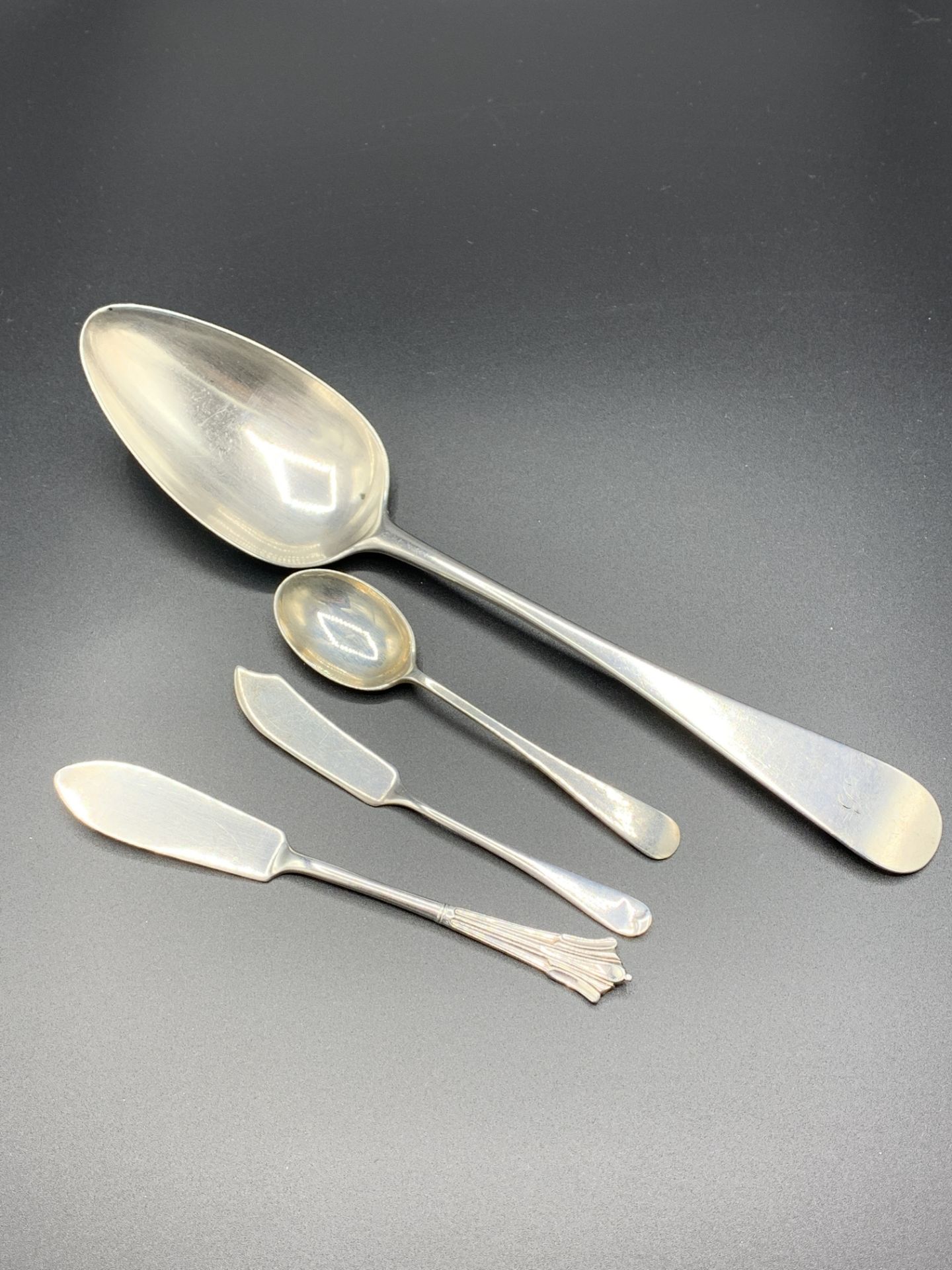 Georgian Scottish silver serving spoon, two butter knives and a teaspoon