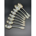 Two silver dessert spoons together with six silver teaspoons