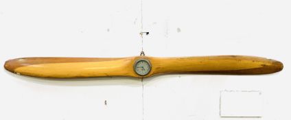 Wooden propeller, 52 35 1159 (2 86) mounted with a Smiths clockwork clock (going)