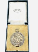 Silver medal with coat of arms and inscribed "The Worshipful Company of Farriers of London"