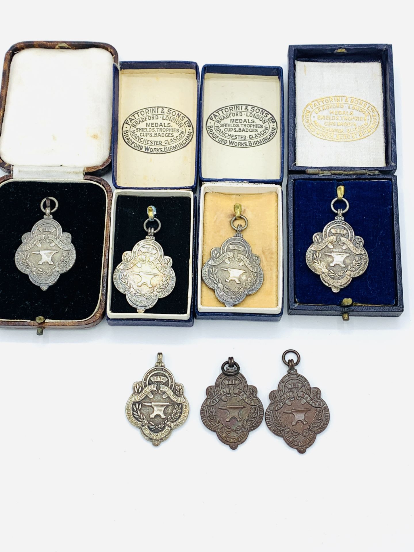 Five hallmarked silver medals by Fattorini & Sons Ltd.