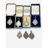 Five hallmarked silver medals by Fattorini & Sons Ltd.