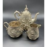 Early 20th Century Asian silver teapot, sugar bowl and mask jug