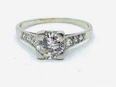 White gold single stone diamond ring with diamond shoulders