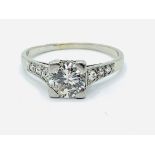 White gold single stone diamond ring with diamond shoulders