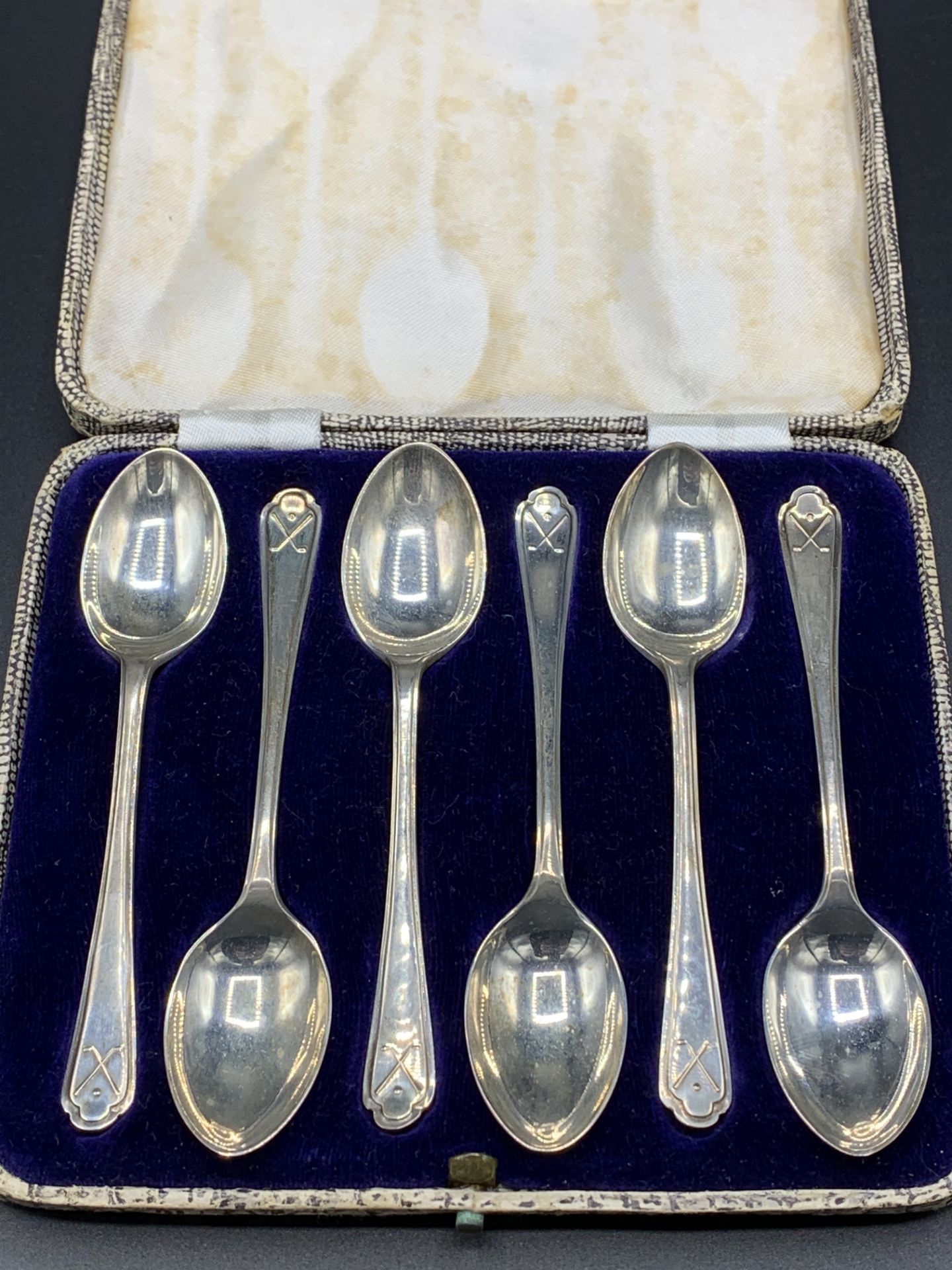 Six "golfers" silver teaspoons in case by Walker & Hall