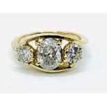 18ct gold 3 stone oval and round diamond ring
