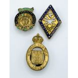 Three early 20th century brass lapel badges