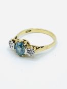 Rare blue zircon and diamond ring set in 18ct gold